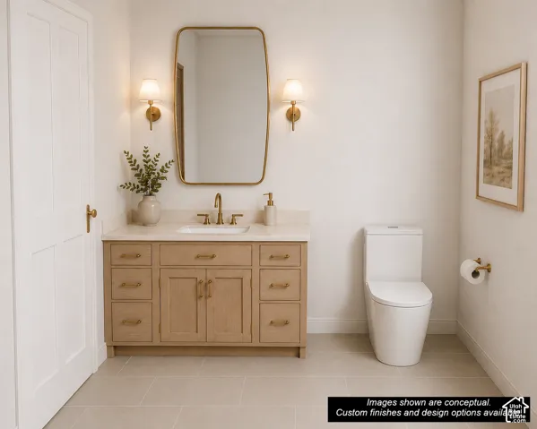 Bathroom featuring a light wood-finish vanity with a light-toned countertop, a rectangular mirror with a metal frame, and two wall-mounted sconces