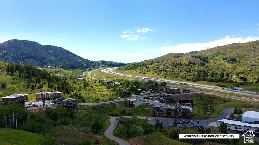 Elevated aerial perspective showcasing a mountainous landscape with extensive green foliage
