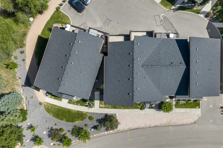 Overhead perspective showcasing a residential structure with an asphalt shingle roof