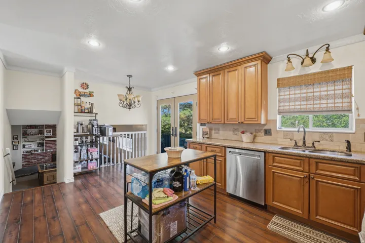 Kitchen featuring wood-finish flooring, recessed lighting, and a chandelier