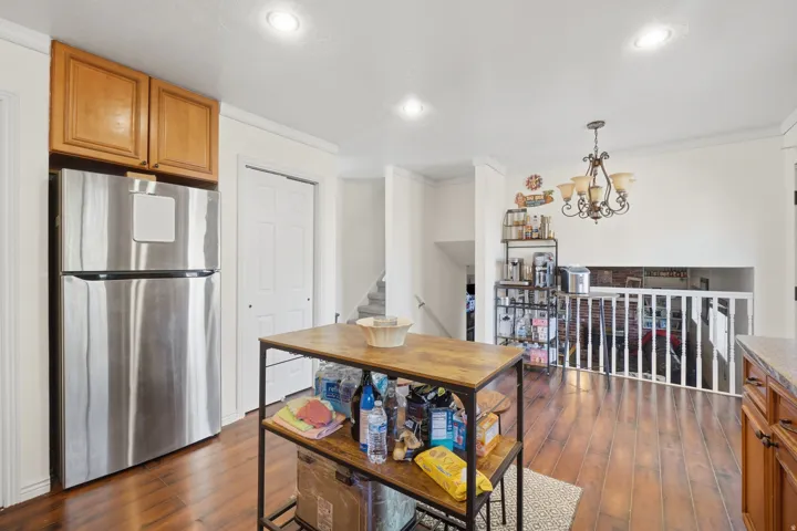 Kitchen area featuring wood-finish flooring and recessed lighting