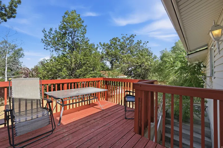 Wood deck with reddish-brown stain and matching railings