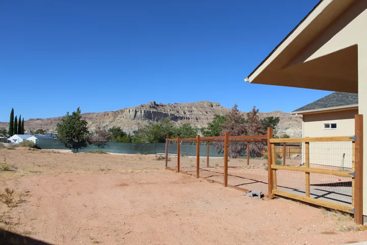 Expansive undeveloped lot with partial wire fencing