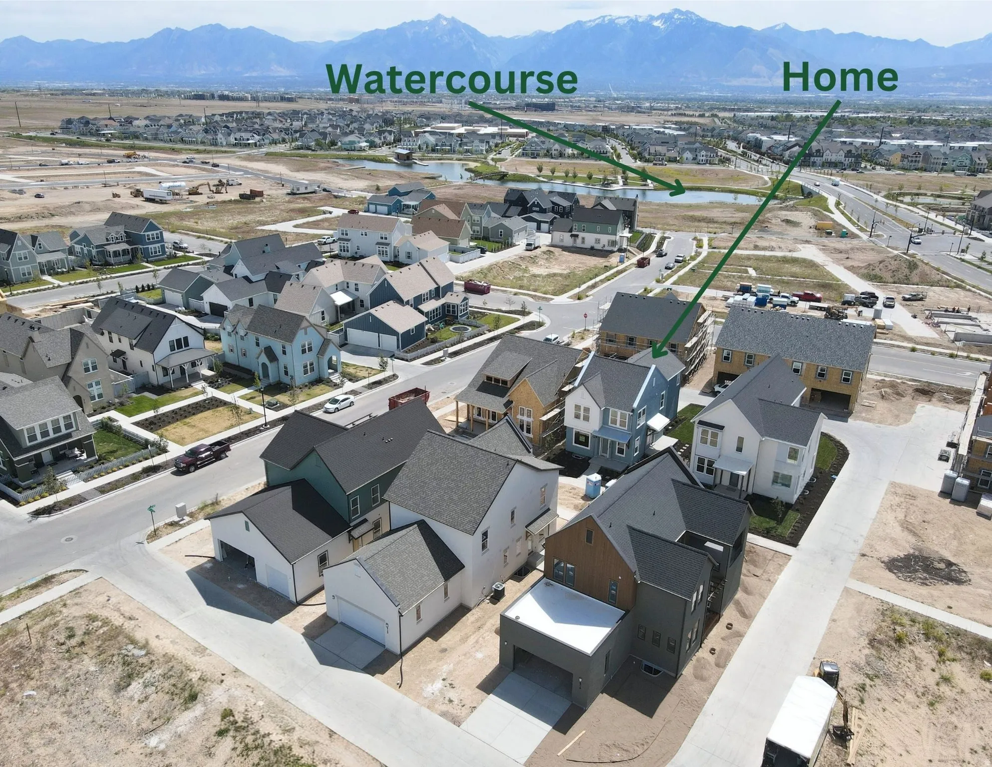 Aerial view of a residential neighborhood with distant mountains