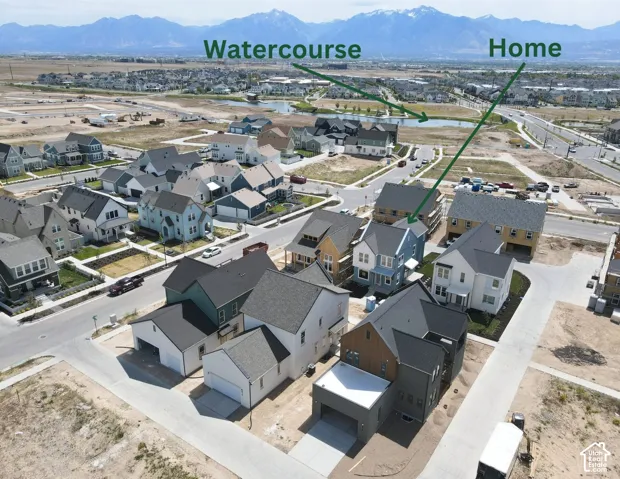 Aerial view of a residential neighborhood with distant mountains