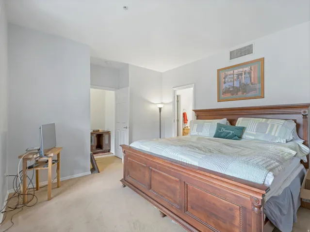 Spacious room featuring neutral carpeting and light gray wall tones