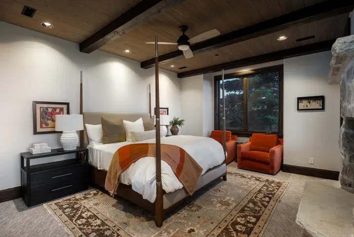 Wood-paneled ceiling with exposed beams