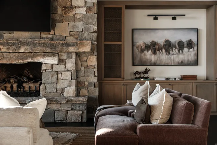 Stone-clad fireplace with a thick timber mantel
