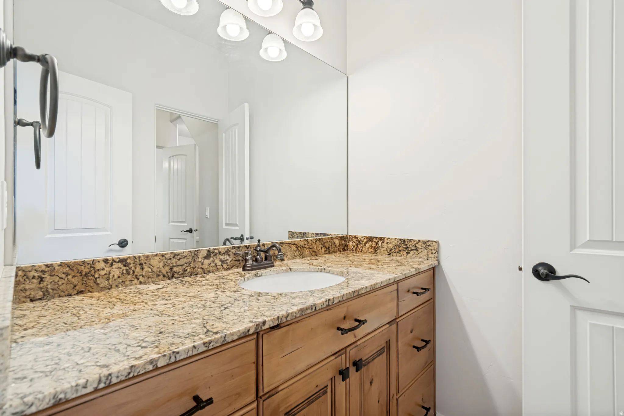 Upstairs bedroom #2 private vanity and sink with granite countertop.
