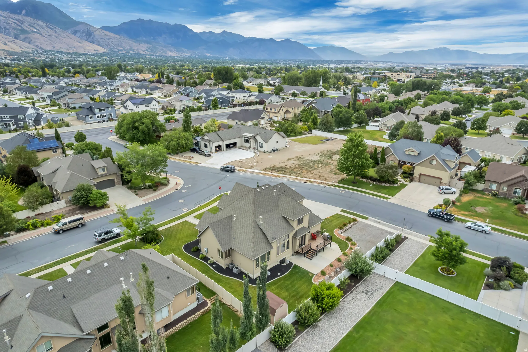 Expansive residential neighborhood featuring paved streets and manicured landscaping
