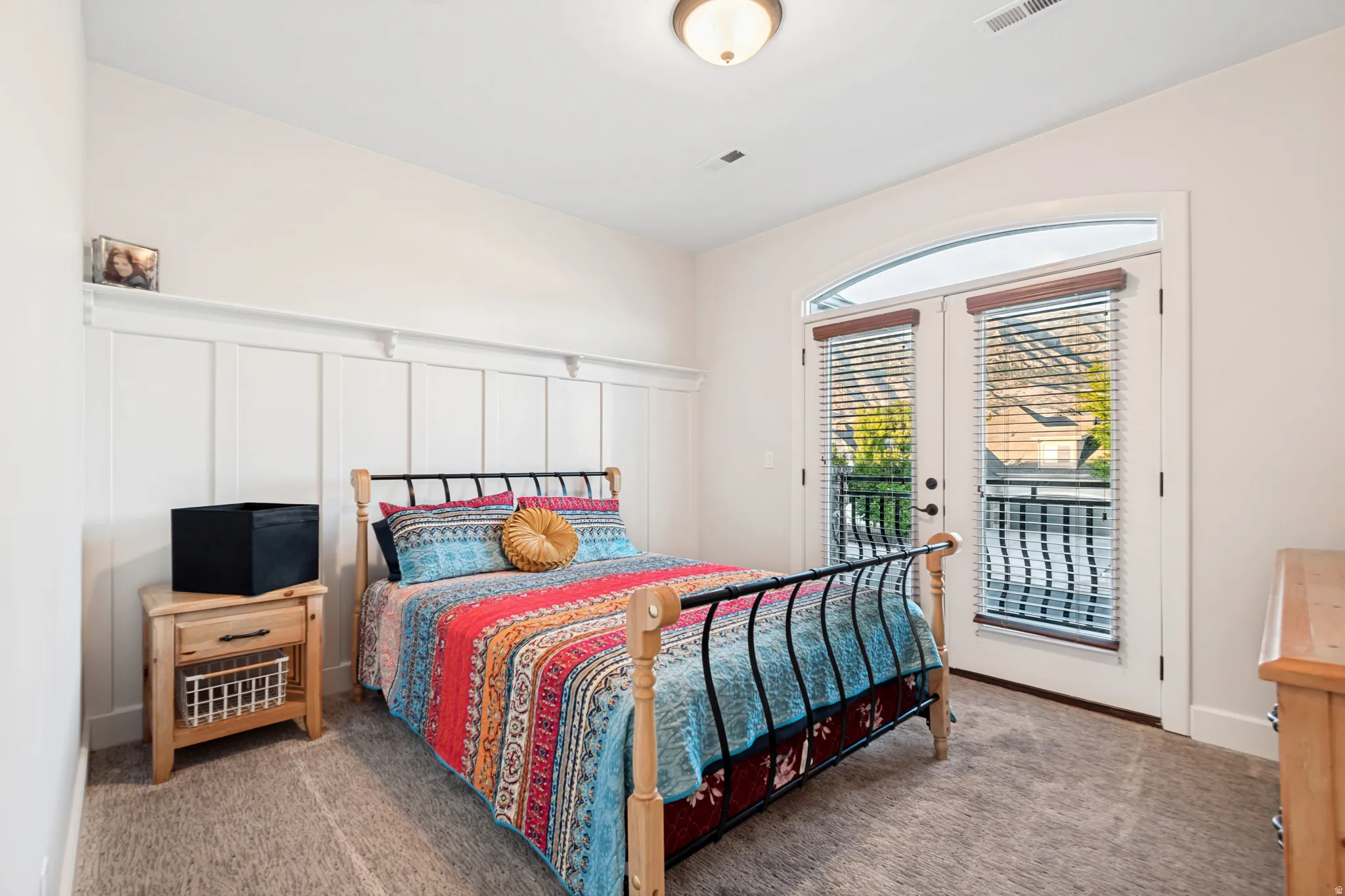 Upstairs bedroom #1 featuring French doors, a balcony, and incredible mountain views,