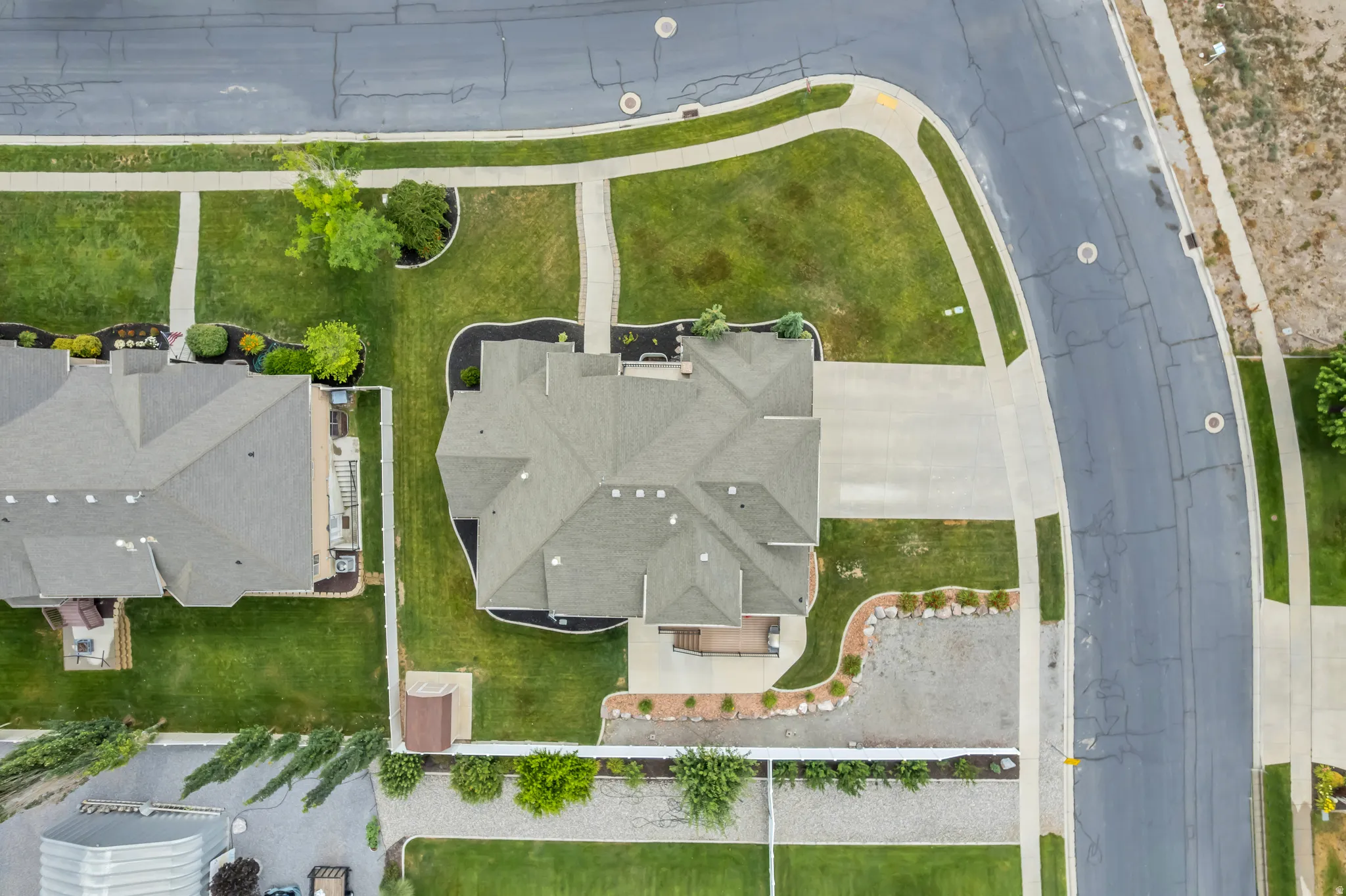 Top Aerial View featuring the expansive corner lot and partially-fenced yard.