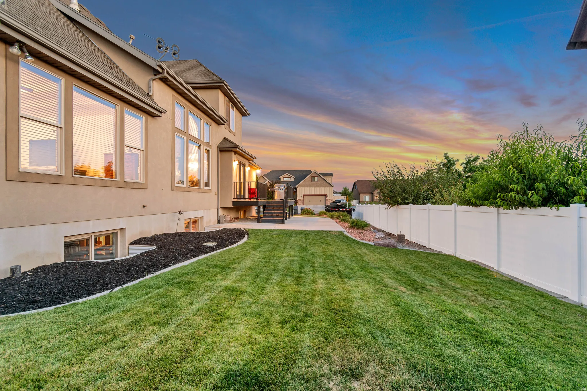 Rear exterior with well-maintained landscaping.
