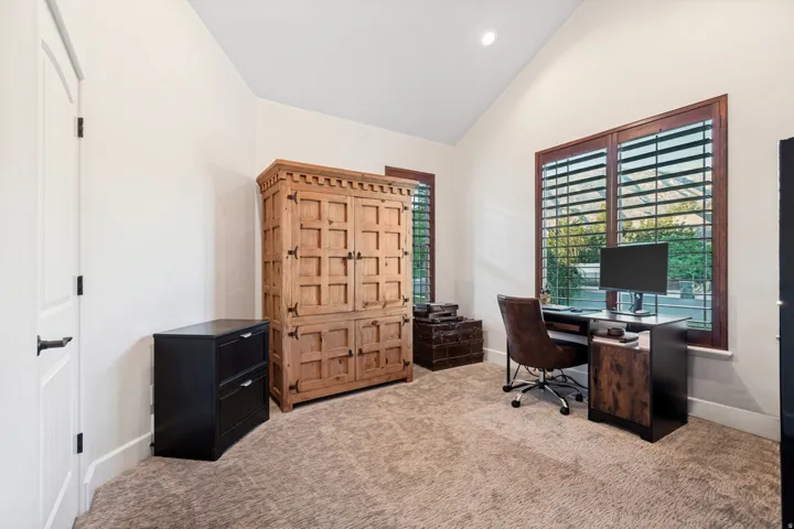 Carpeted office with vaulted ceilings, closet space, and incredible mountain views.