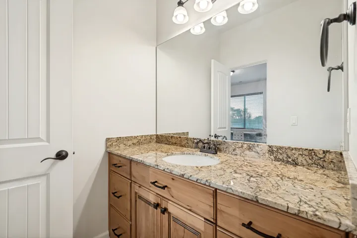 Upstairs bedroom #3 private vanity and sink with granite countertop.