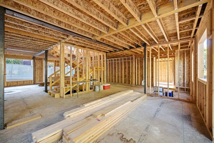 Wood framing construction with exposed ceiling joists and subfloor