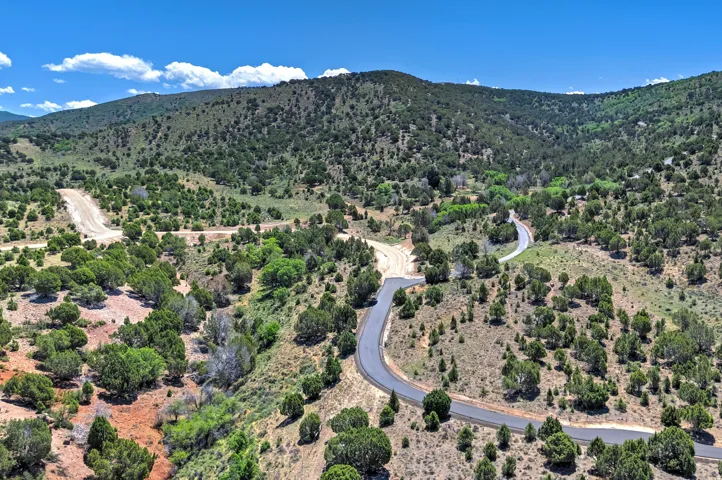 Expansive rural terrain featuring paved and unpaved roads