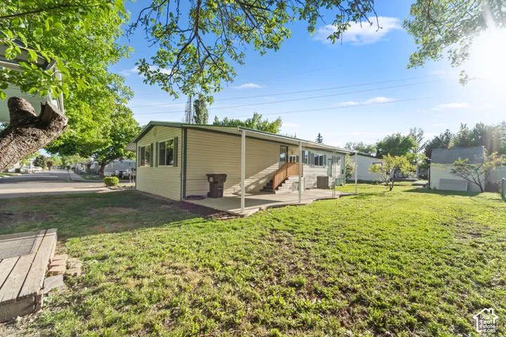 Expansive green lawn with mature trees