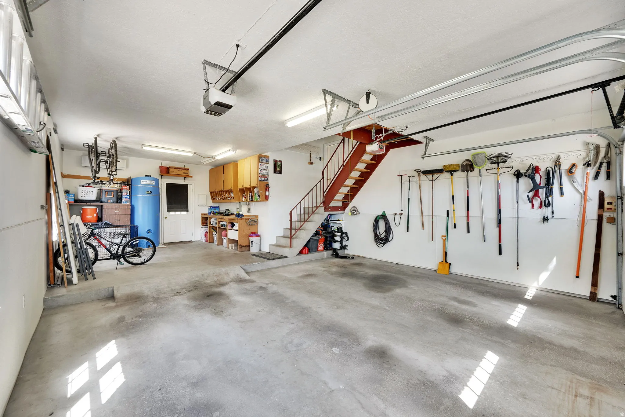 Extra length garage featuring stairs to bonus room for office, etc.