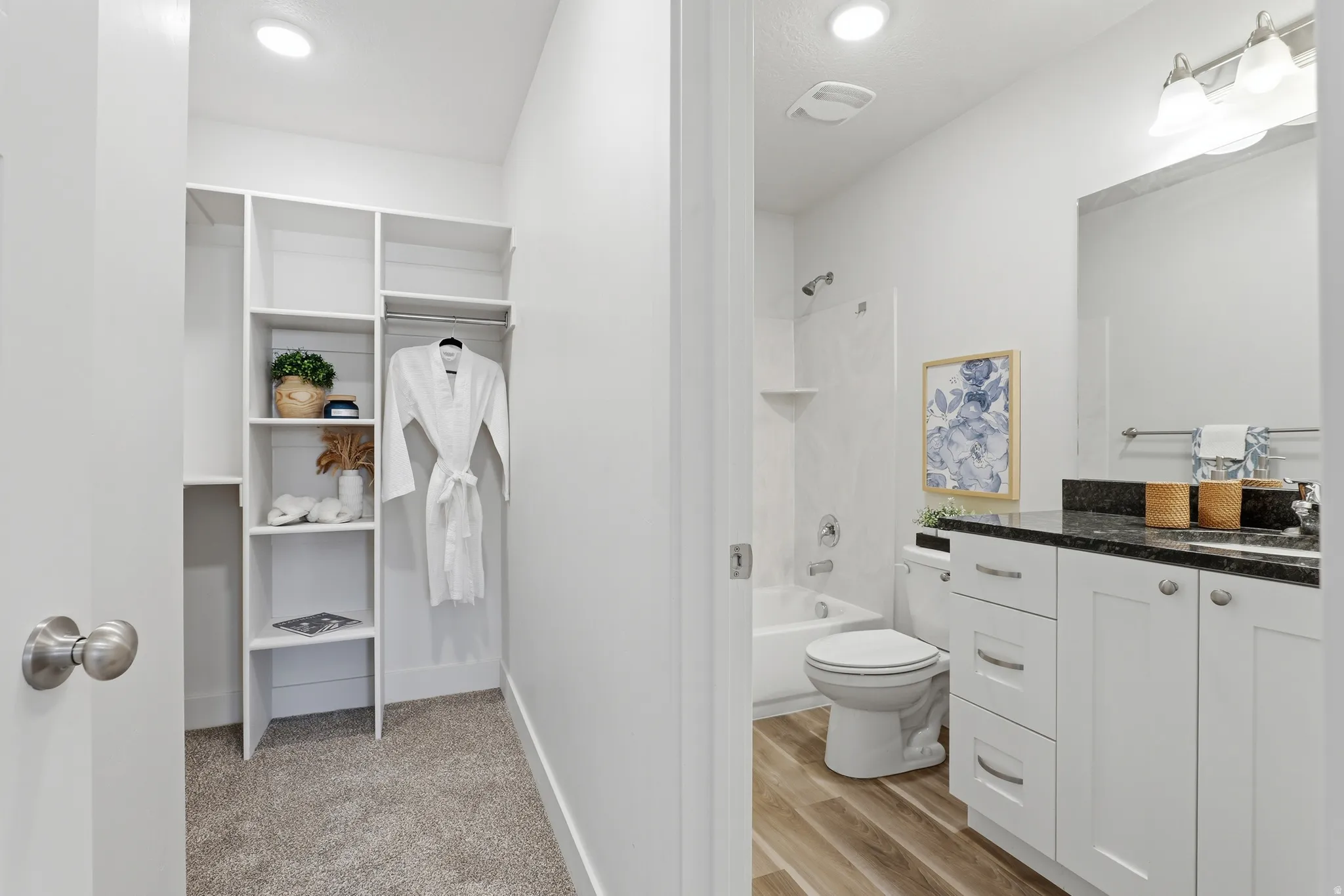 Walk-in closet with built-in shelving and hanging rod