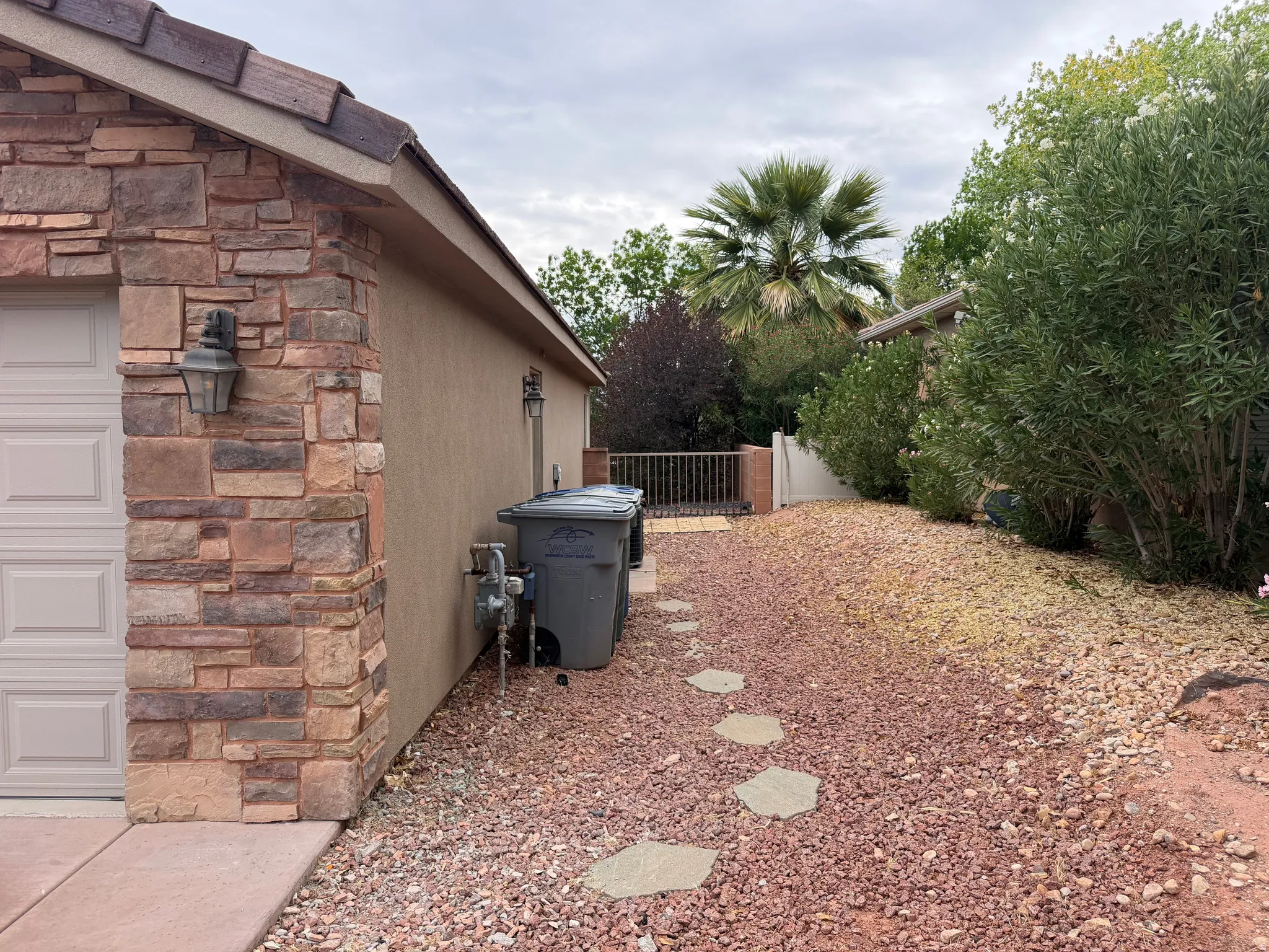 Exterior siding featuring stacked stone accents and stucco finish