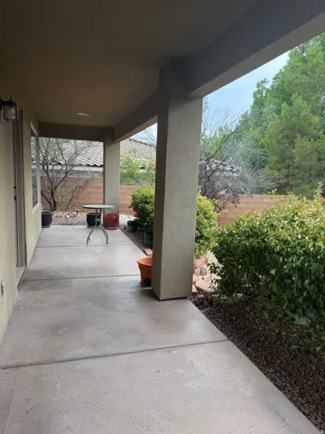Expansive covered patio with concrete slab flooring