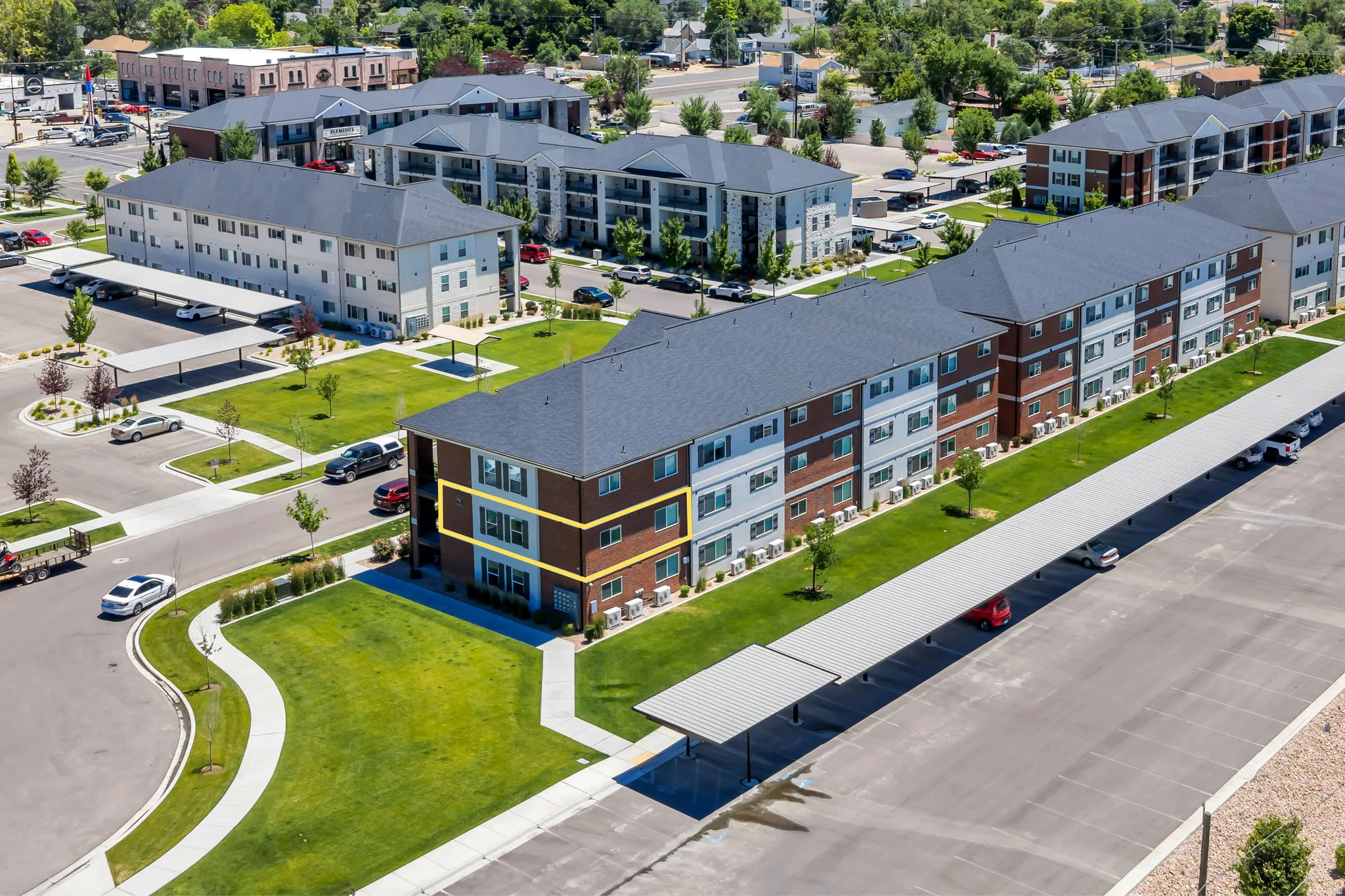 Multi-story residential building with brick and siding exterior