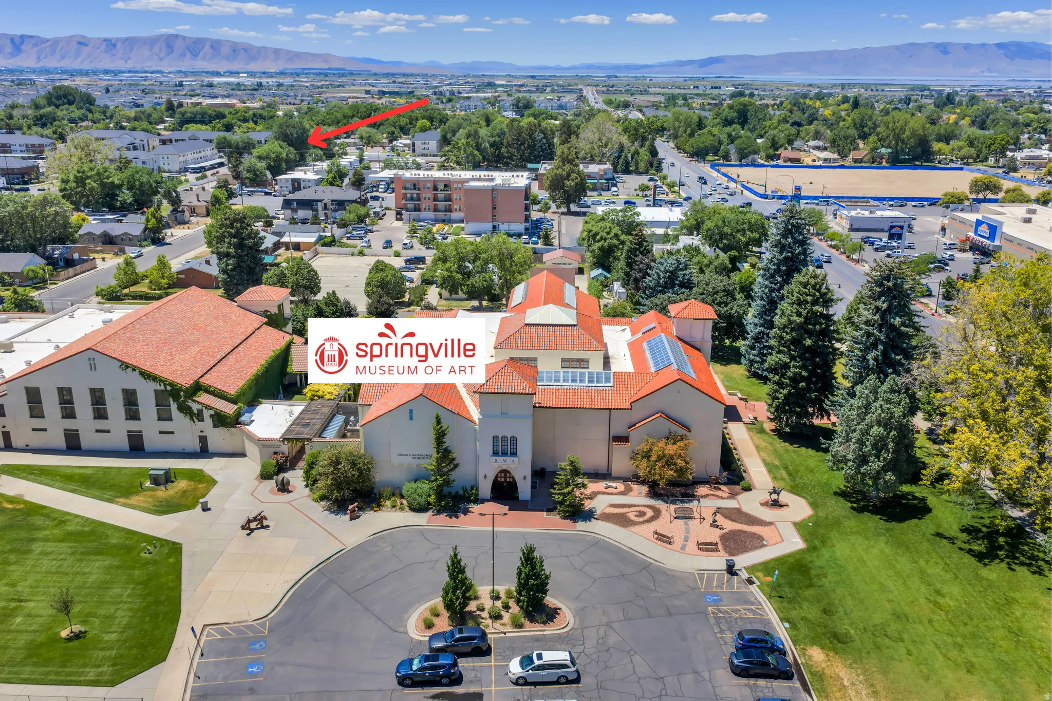 Aerial perspective showcasing the Springville Museum of Art with its distinctive terracotta roof and surrounding landscape