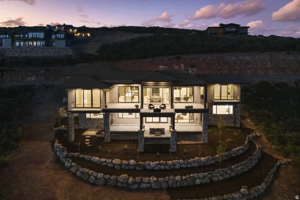 Modern architectural style with multiple levels of balconies and patios