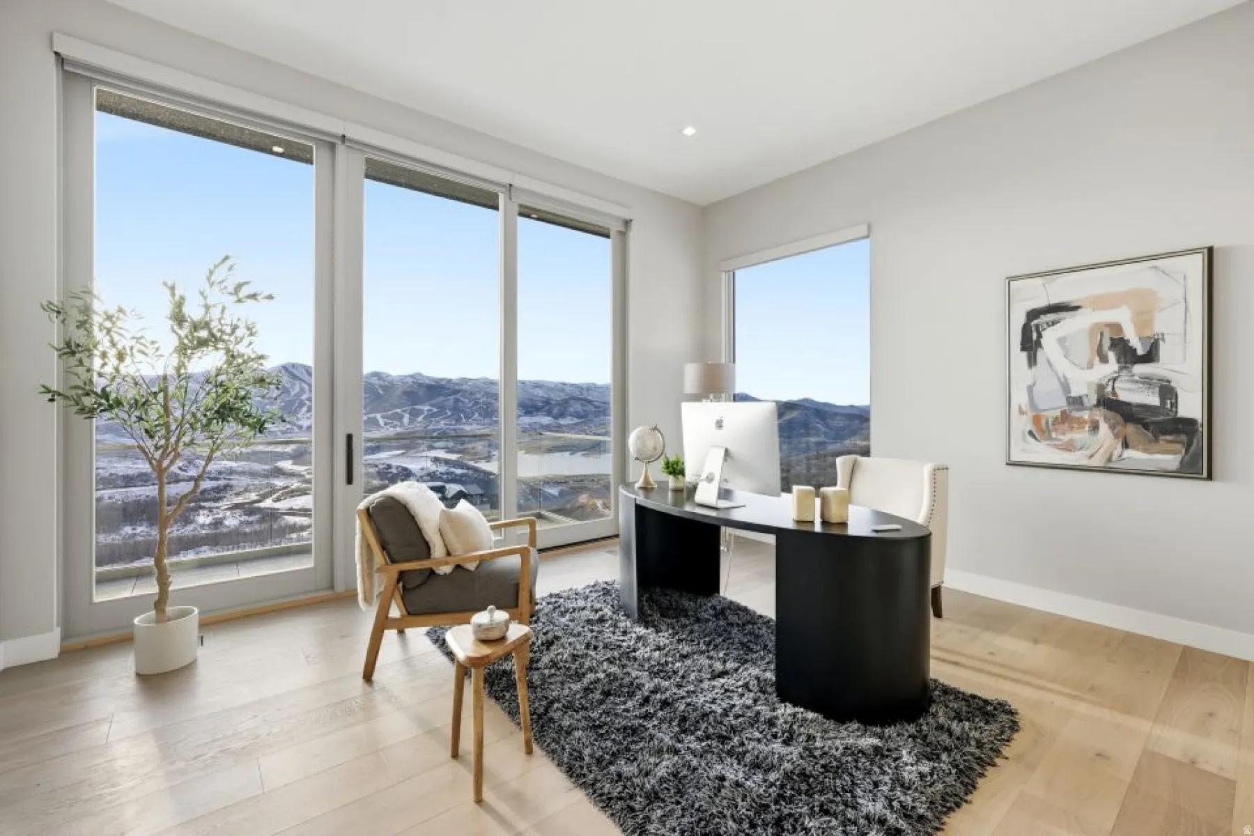 Spacious room with expansive sliding glass doors and a large picture window