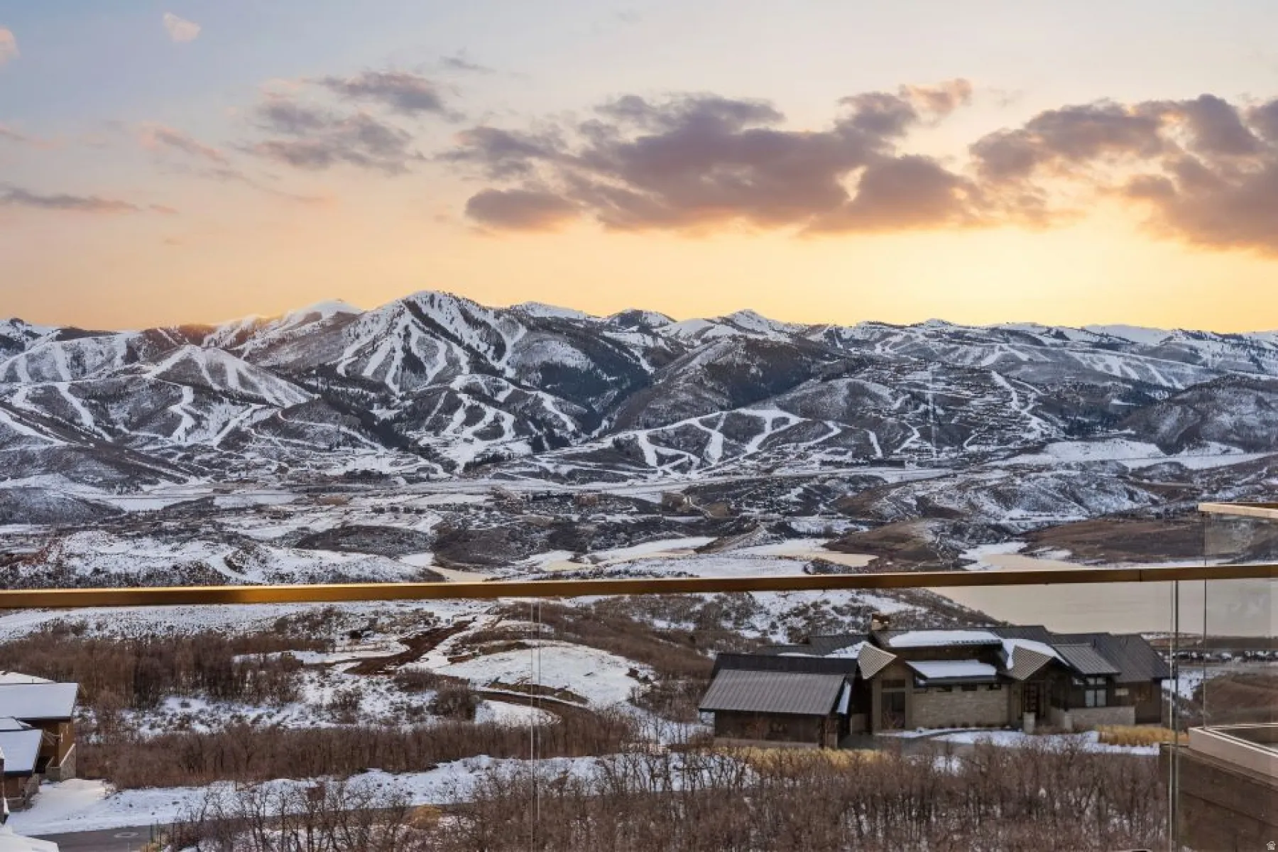 Expansive mountain landscape with snow-covered terrain