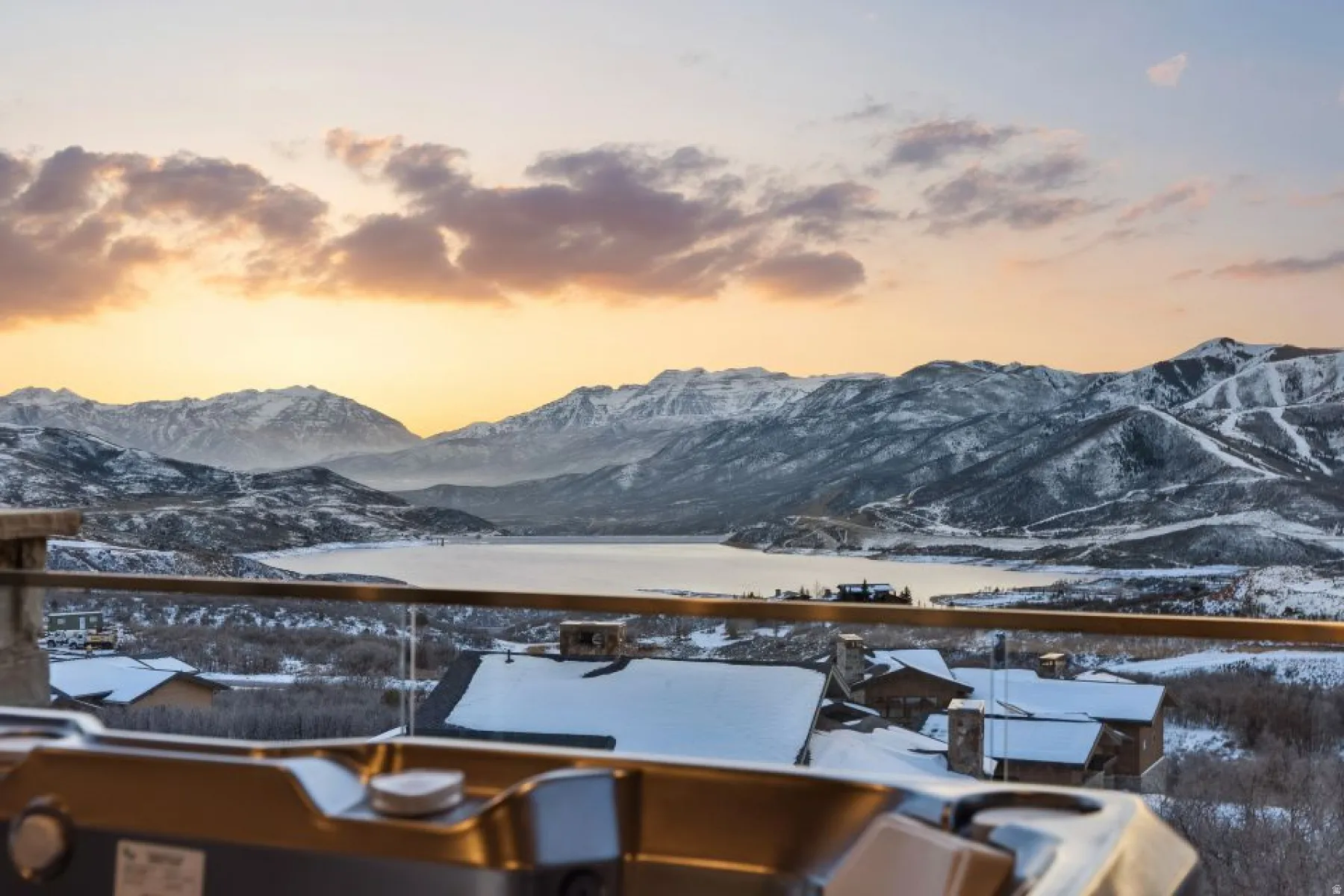 Outdoor hot tub with mountain and lake scenery