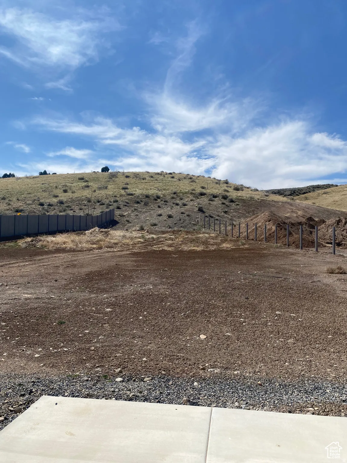 Expansive undeveloped lot with natural hillside backdrop