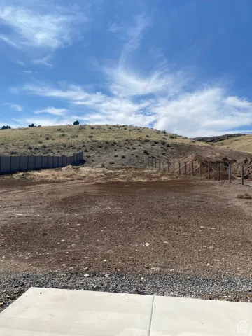 Expansive undeveloped lot with natural hillside backdrop