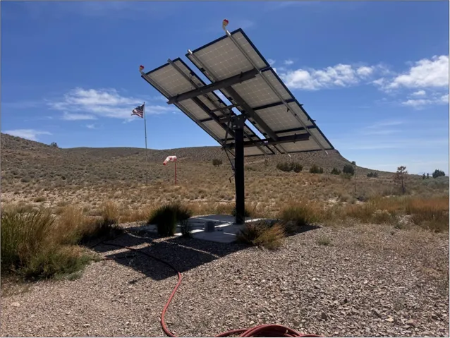 Ground-mounted solar panel array featuring multiple panels