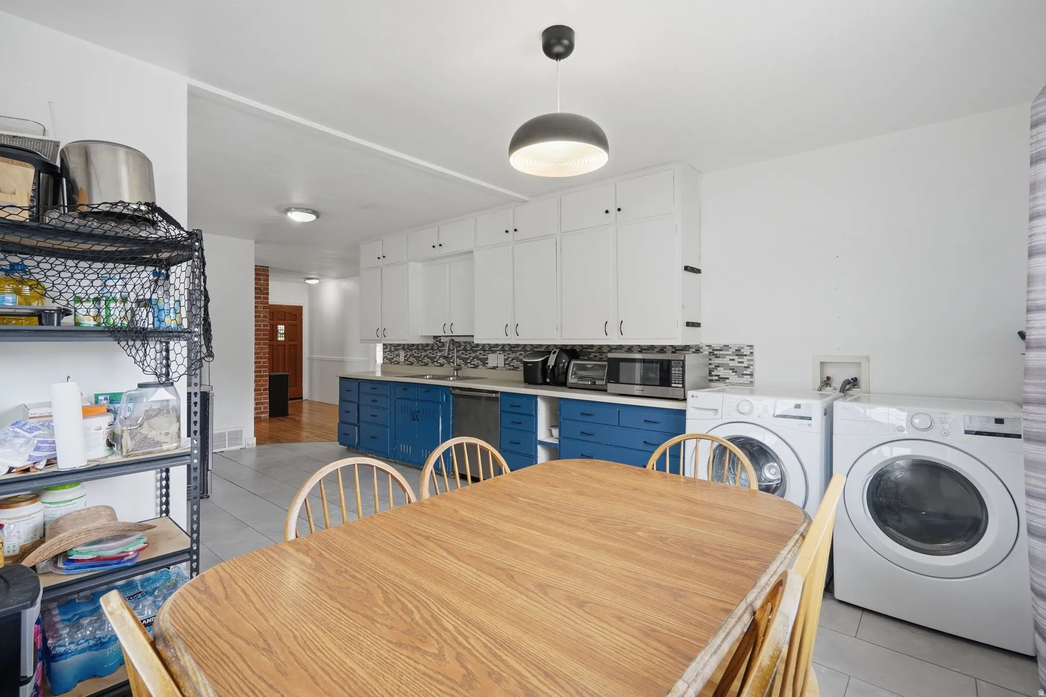 Kitchen with laundry room and eating area