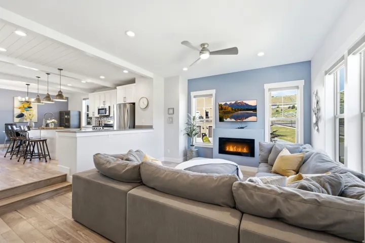 Open concept living area featuring wood-finish flooring