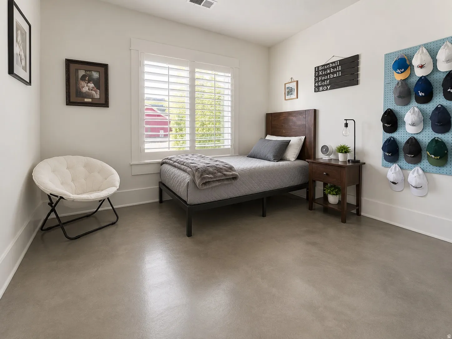 Spacious room with smooth, light-toned flooring and white baseboards