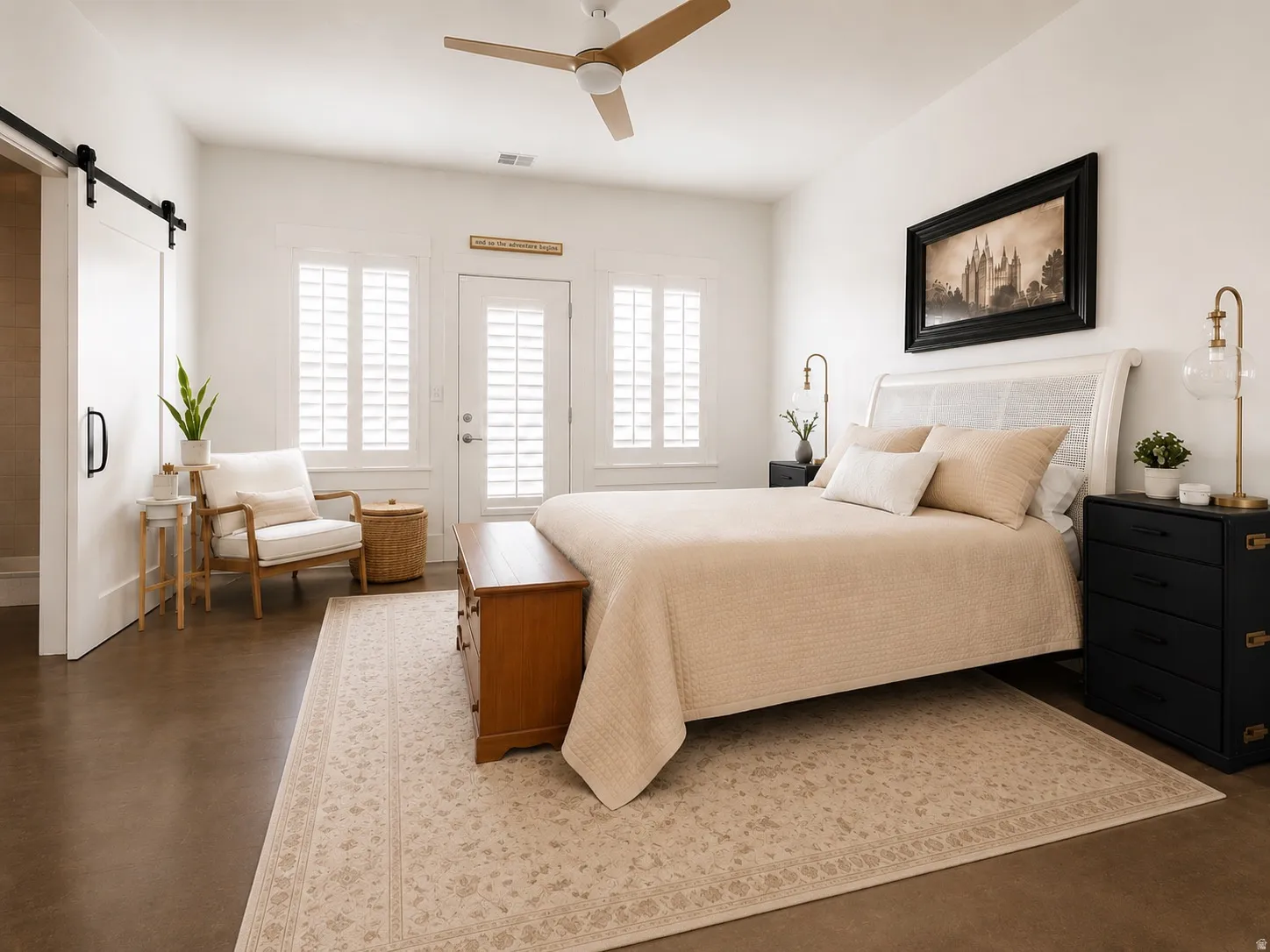 Spacious room featuring white walls, and a ceiling fan