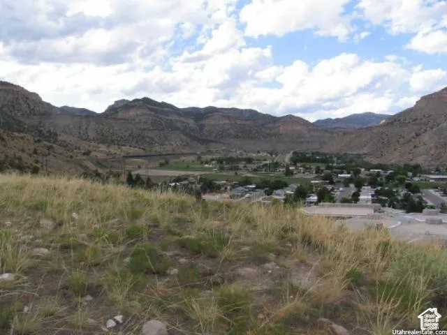 Elevated property featuring natural ground cover and expansive mountain terrain