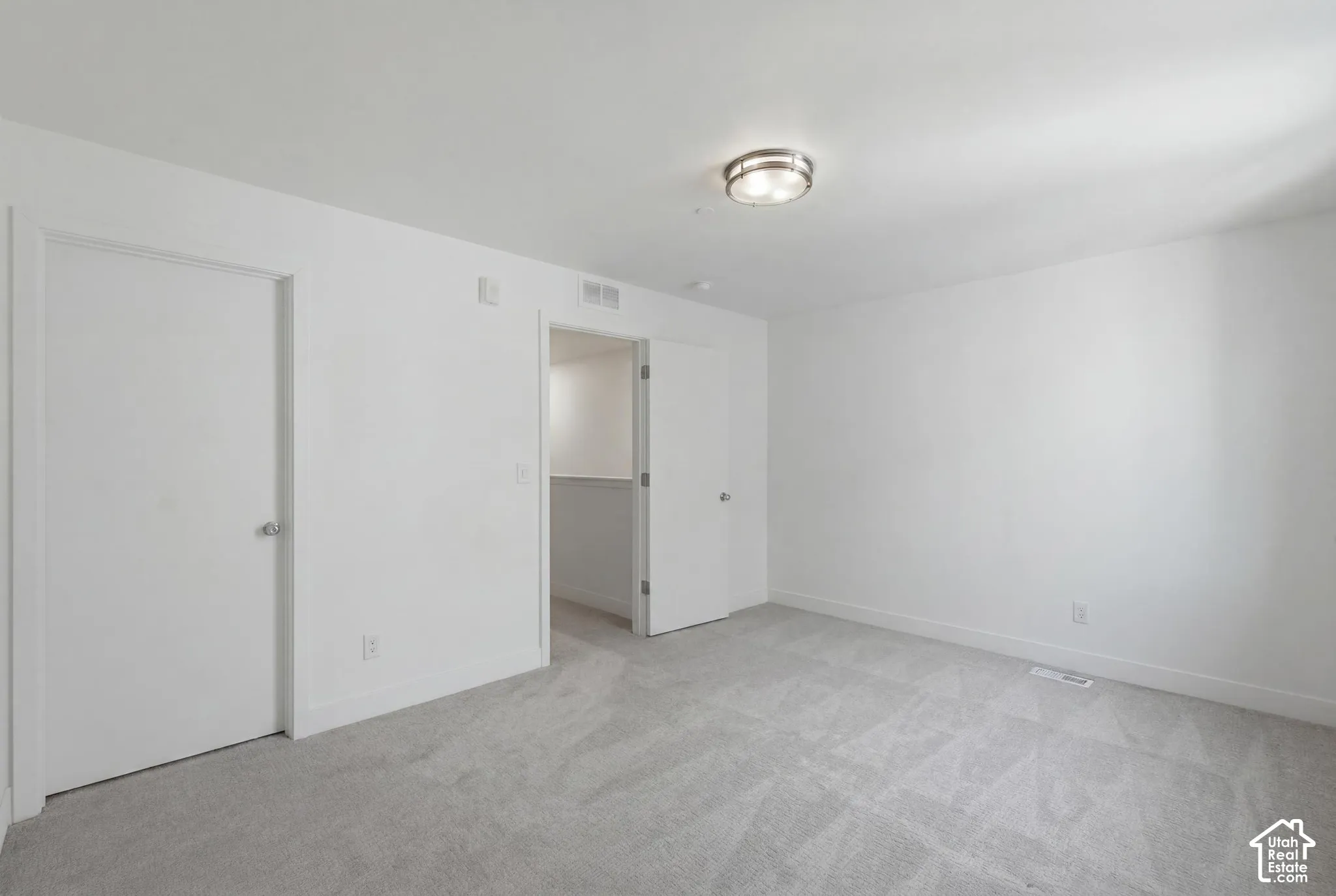 Second ensuite bedroom on upper level with walk-in closet