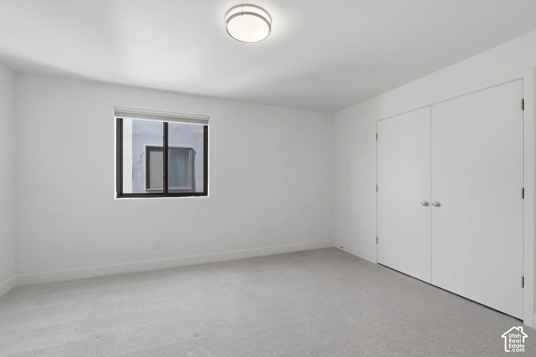 Second ensuite bedroom on upper level with walk-in closet