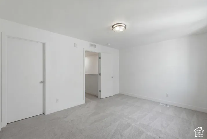 Second ensuite bedroom on upper level with walk-in closet