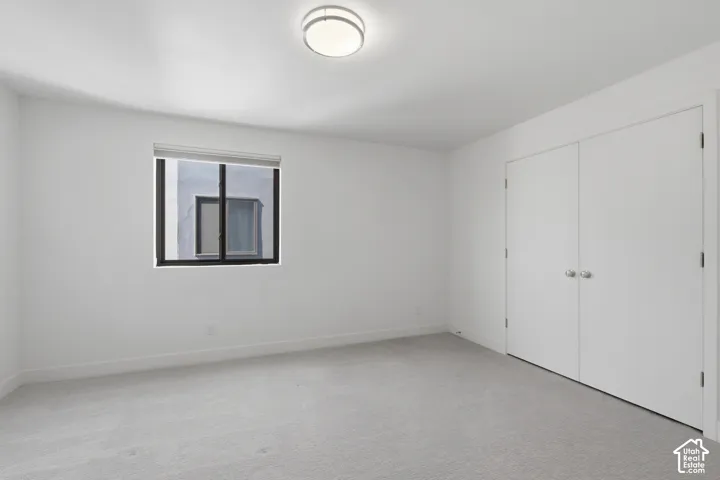 Second ensuite bedroom on upper level with walk-in closet