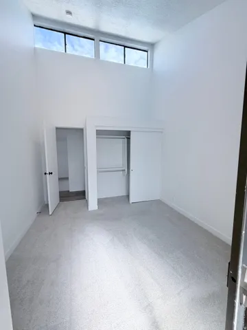 Interior room with vaulted ceilings and high-level windows
