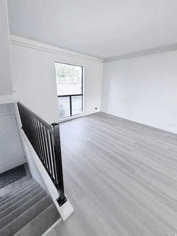 Open concept living area featuring light wood-finish flooring