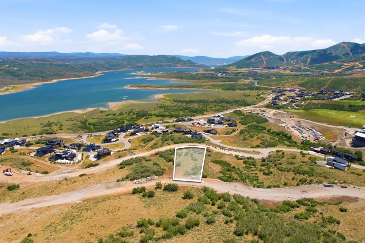 Generous parcel of land set against a backdrop of distant mountains and a large body of water