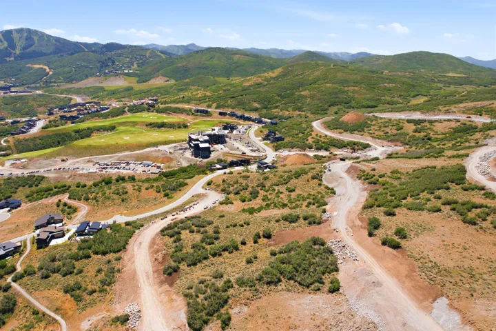 Expansive mountain landscape featuring varied terrain and multiple development areas
