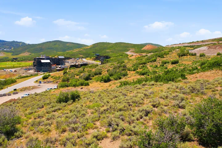 Expansive undeveloped land featuring natural shrubbery and varied terrain