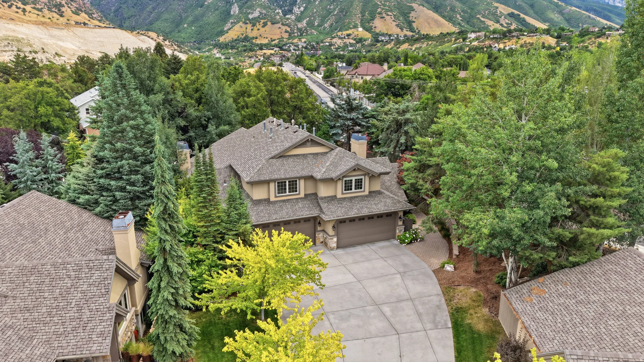 Two-story residence with a multi-gabled roofline and attached two-car garage